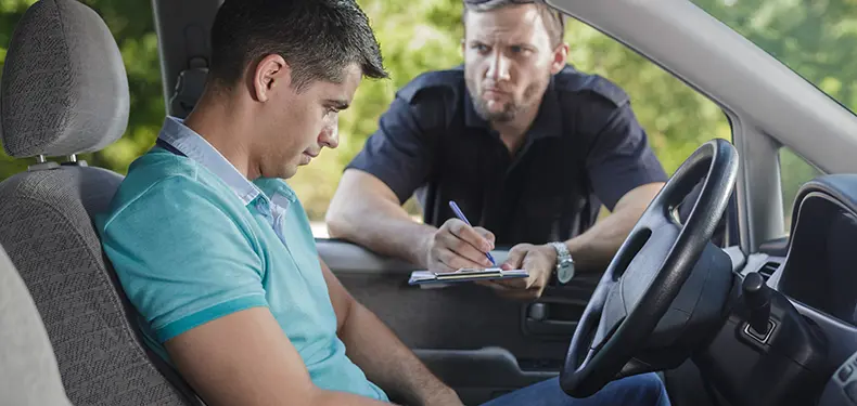 A photo of a driver receiving a ticket.