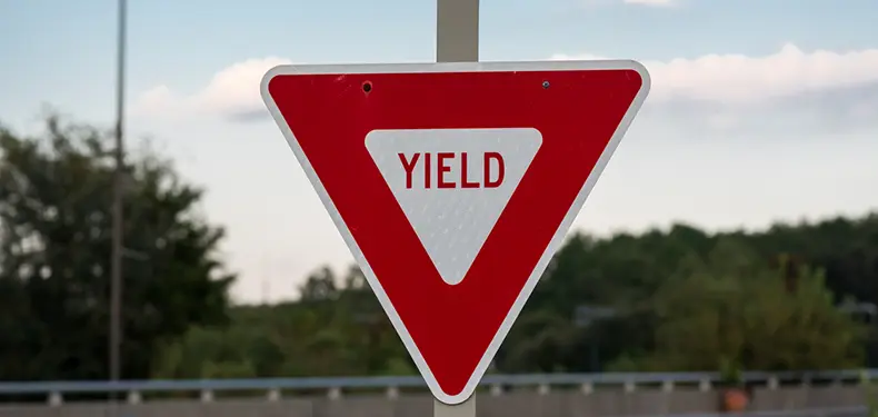 A photo of a 'Yield' traffic sign.